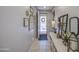 Decorated entryway with tiled floors, leading into a bright and welcoming home at 23781 W Mohave St, Buckeye, AZ 85326