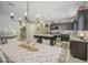 Well-designed kitchen and dining area with modern lighting and ample seating at 23781 W Mohave St, Buckeye, AZ 85326