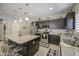Spacious kitchen island with granite countertops and ample seating, ideal for Gathering gatherings at 23781 W Mohave St, Buckeye, AZ 85326