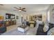 Spacious living room featuring a ceiling fan, comfortable sofas, and stylish decor at 23781 W Mohave St, Buckeye, AZ 85326