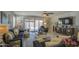 Comfortable living room featuring stylish furniture, large windows, and an open floor plan at 23781 W Mohave St, Buckeye, AZ 85326