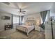 Comfortable main bedroom with a ceiling fan and soft natural light, creating a relaxing atmosphere at 23781 W Mohave St, Buckeye, AZ 85326