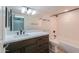 Modern bathroom with a dark wood vanity, white marble countertop, and brushed nickel fixtures at 238 W Myrna Ln, Tempe, AZ 85284