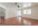 Bright bedroom with hardwood floors, a ceiling fan, and access to the backyard at 238 W Myrna Ln, Tempe, AZ 85284