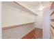 Walk-in closet featuring built-in shelves and ample storage space at 238 W Myrna Ln, Tempe, AZ 85284