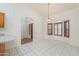 Dining room featuring tile floors, a bay window with shutters, and a chandelier, perfect for entertaining at 238 W Myrna Ln, Tempe, AZ 85284