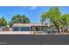 Charming single-story home featuring a three-car garage, mature trees, and a well-maintained front yard at 238 W Myrna Ln, Tempe, AZ 85284