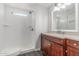 Bathroom featuring white shower, toilet and wood vanity at 2650 W Union Hills Dr # 245, Phoenix, AZ 85027