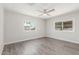 Bright bedroom featuring wood-look flooring and dual windows at 2650 W Union Hills Dr # 245, Phoenix, AZ 85027