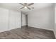 Spacious bedroom with gray walls, closet and wood-look floors at 2650 W Union Hills Dr # 245, Phoenix, AZ 85027
