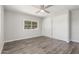 Bedroom boasting ceiling fan, gray walls, wood-look floors and closet at 2650 W Union Hills Dr # 245, Phoenix, AZ 85027