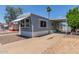 Charming manufactured home featuring a covered parking area and low-maintenance landscaping at 2650 W Union Hills Dr # 245, Phoenix, AZ 85027