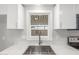 Kitchen sink with white cabinets, stone countertops and window at 2650 W Union Hills Dr # 245, Phoenix, AZ 85027