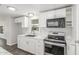 Updated kitchen featuring stainless steel appliances, new countertops, and bright white cabinetry at 2650 W Union Hills Dr # 245, Phoenix, AZ 85027