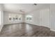 Spacious living room with lots of natural light, wood floors, and a fresh, modern interior at 2650 W Union Hills Dr # 245, Phoenix, AZ 85027