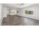 Bright open-concept space flows into the kitchen featuring stylish wood flooring and neutral paint at 2650 W Union Hills Dr # 245, Phoenix, AZ 85027