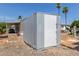Exterior shed and car port with two palm trees and additional landscaping at 2650 W Union Hills Dr # 245, Phoenix, AZ 85027