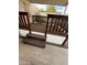 Covered patio area with dark wood railing and tan carpet at 300 S Val Vista Dr # 51, Mesa, AZ 85204