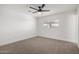 Neutral bedroom featuring ceiling fan, new carpet, and window with blinds at 3021 E Windrose Dr, Phoenix, AZ 85032