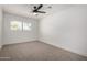 Bedroom with carpet, ceiling fan, a window with blinds, and fresh paint at 3021 E Windrose Dr, Phoenix, AZ 85032