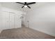 Light-filled bedroom with neutral walls, new carpet, ceiling fan, and a closet at 3021 E Windrose Dr, Phoenix, AZ 85032