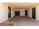 Spacious carport with access door to the home and views of the backyard area at 3021 E Windrose Dr, Phoenix, AZ 85032