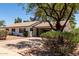 Inviting single-story home with well-maintained landscaping and a covered front entryway at 3021 E Windrose Dr, Phoenix, AZ 85032
