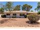 Charming single-story home with desert landscaping and mature trees in the front yard at 3021 E Windrose Dr, Phoenix, AZ 85032