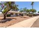 Charming single-story home with desert landscaping and mature trees in a quiet neighborhood at 3021 E Windrose Dr, Phoenix, AZ 85032