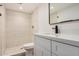 Updated bathroom featuring neutral tiling, modern fixtures, and shower at 308 W Oraibi Dr, Phoenix, AZ 85027