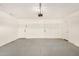 Clean and well-lit garage features a neutral color palette and plenty of space at 308 W Oraibi Dr, Phoenix, AZ 85027
