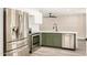 Updated kitchen with stainless steel appliances, white cabinets, and modern sink and faucet at 308 W Oraibi Dr, Phoenix, AZ 85027