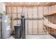 Well-organized utility room including water heater and softener at 308 W Oraibi Dr, Phoenix, AZ 85027