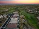 Scenic aerial view of a golf course community with lush green fairways and luxurious homes at 31210 N 122Nd Ln, Peoria, AZ 85383