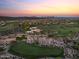 Breathtaking aerial view of a home in a golf community surrounded by desert landscape at 31210 N 122Nd Ln, Peoria, AZ 85383