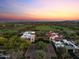 Beautiful aerial view of estate home and golf course community at sunset at 31210 N 122Nd Ln, Peoria, AZ 85383