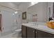 Well-lit bathroom featuring a glass-enclosed shower, ample vanity space, and modern fixtures at 31210 N 122Nd Ln, Peoria, AZ 85383