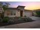 Attractive house featuring a stone facade, desert landscaping, and well-kept curb appeal at 31210 N 122Nd Ln, Peoria, AZ 85383