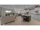 Spacious open-concept with kitchen island, stainless appliances, and large living area at 31210 N 122Nd Ln, Peoria, AZ 85383