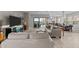 Spacious living area with comfortable seating, seamless indoor-outdoor access, and views of the backyard and beyond at 31210 N 122Nd Ln, Peoria, AZ 85383