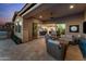 Charming outdoor patio with a comfortable seating area, perfect for entertaining at 31210 N 122Nd Ln, Peoria, AZ 85383