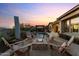 Relaxing poolside retreat with comfortable seating and a cozy fire pit at 31210 N 122Nd Ln, Peoria, AZ 85383