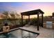 Serene pool area with pergola, grill, and lounge seating, perfect for relaxation at 31210 N 122Nd Ln, Peoria, AZ 85383