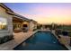 Captivating outdoor living space with a pool, patio, and lush landscaping at 31210 N 122Nd Ln, Peoria, AZ 85383