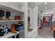Organized walk-in closet with shelving, hanging racks, and ample storage space at 31210 N 122Nd Ln, Peoria, AZ 85383