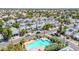 A high angle view of the neighborhood showcases a pool and the surrounding houses on a sunny day at 3389 W Barcelona Dr, Chandler, AZ 85226