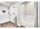 Bathroom with a tub, new walk-in shower and modern black fixtures at 3389 W Barcelona Dr, Chandler, AZ 85226