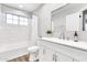 Bright, white bathroom features modern fixtures, a shower/tub combo, and a stylish vanity at 3389 W Barcelona Dr, Chandler, AZ 85226