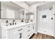 Modern bathroom features dual sinks, black hardware, and a new walk-in shower at 3389 W Barcelona Dr, Chandler, AZ 85226