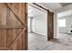 Bedroom view showcasing a sliding barn door and ceiling fan at 3389 W Barcelona Dr, Chandler, AZ 85226